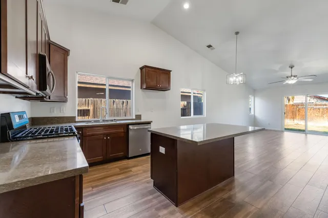 a view of a house with a backyard