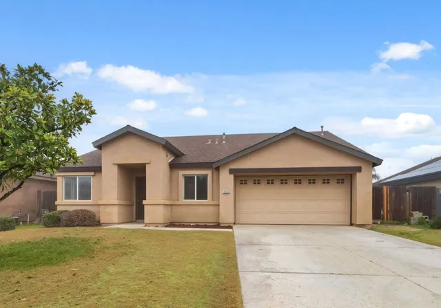 a front view of a house with a rug
