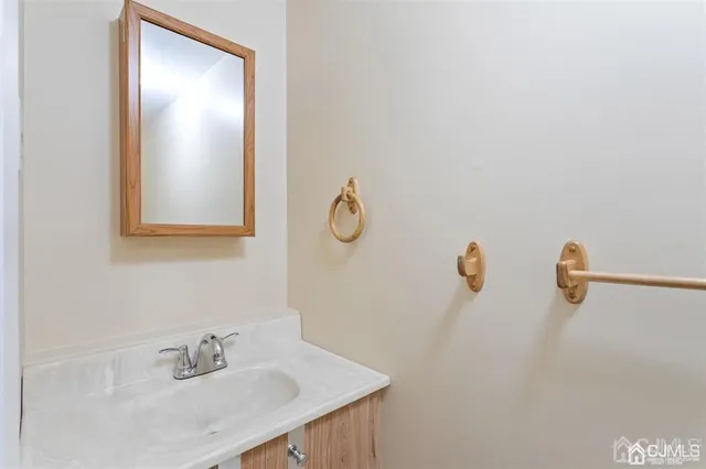 a bathroom with a sink and mirror