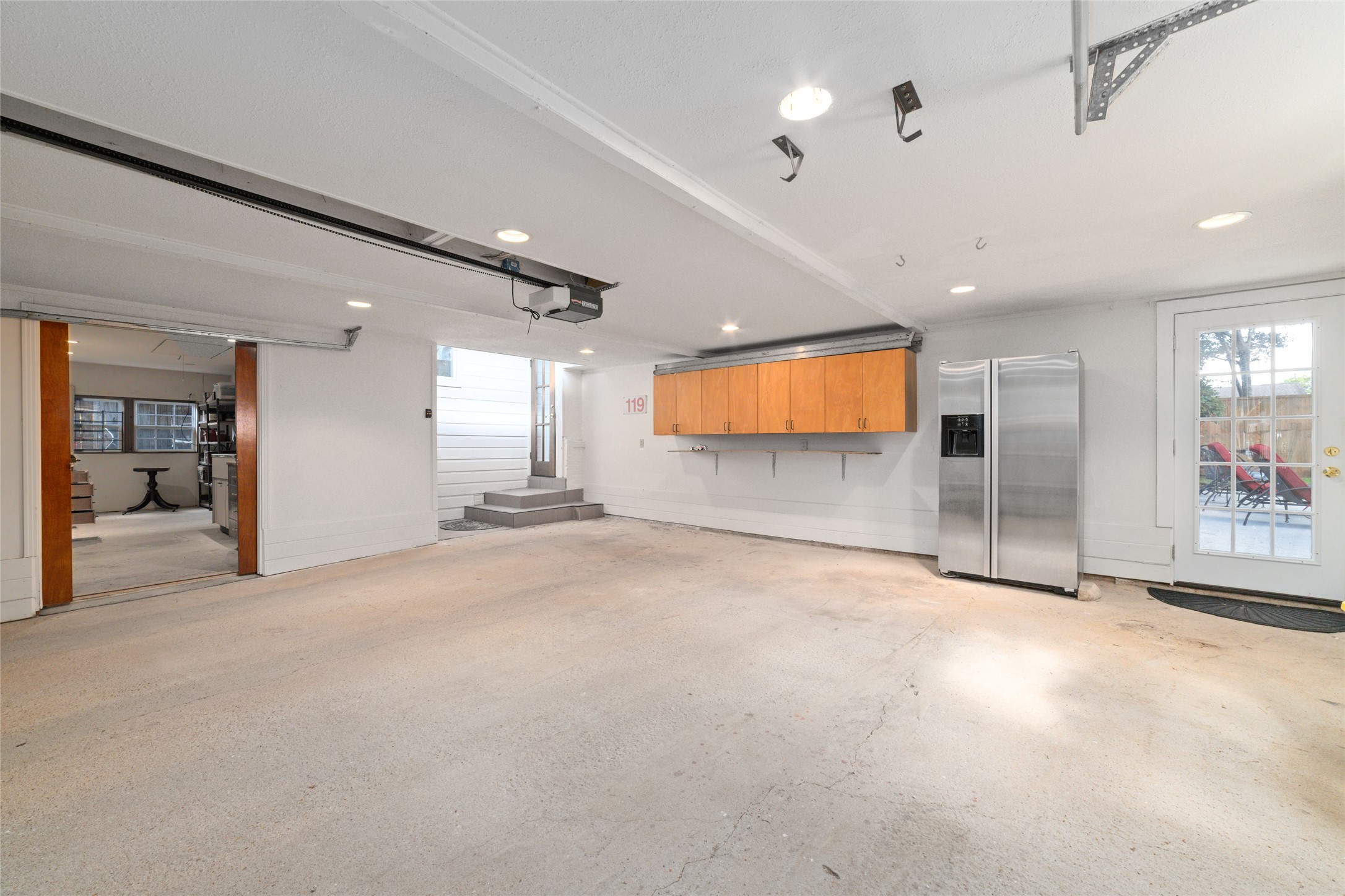 1613 California Street Houston, TX 77006 - Photo 39 of 50 Thoughtfully planned for comfort and convenience, the oversized detached garage connects to the home through the enclosed gallery, creating a seamless transition between the garage, laundry room, primary suite, and the heart of the home, rain or shine.