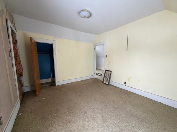 an empty room with a bench