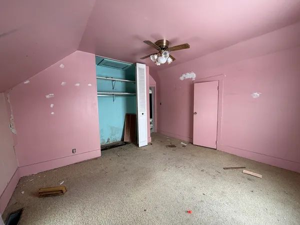 a view of a livingroom with a ceiling fan and a window