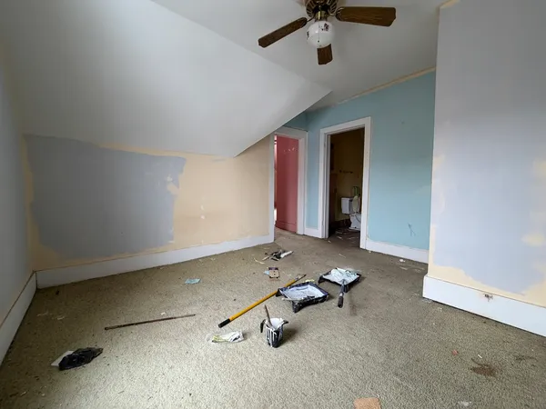 a room with gym equipment and mirrors