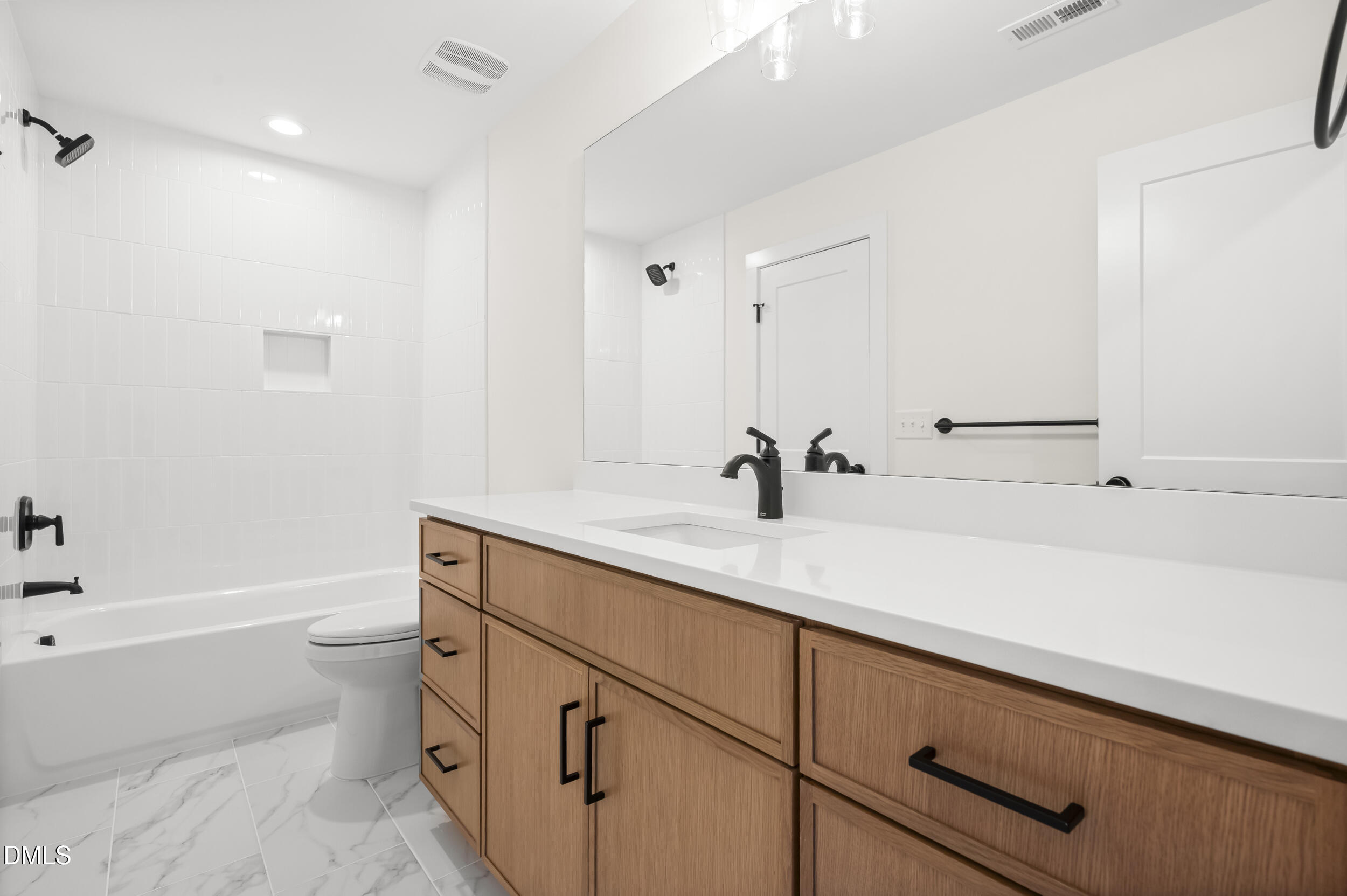 708 Grayhaven Place Raleigh, NC 27606 - Photo 24 of 33 a bathroom with a sink a toilet and shower