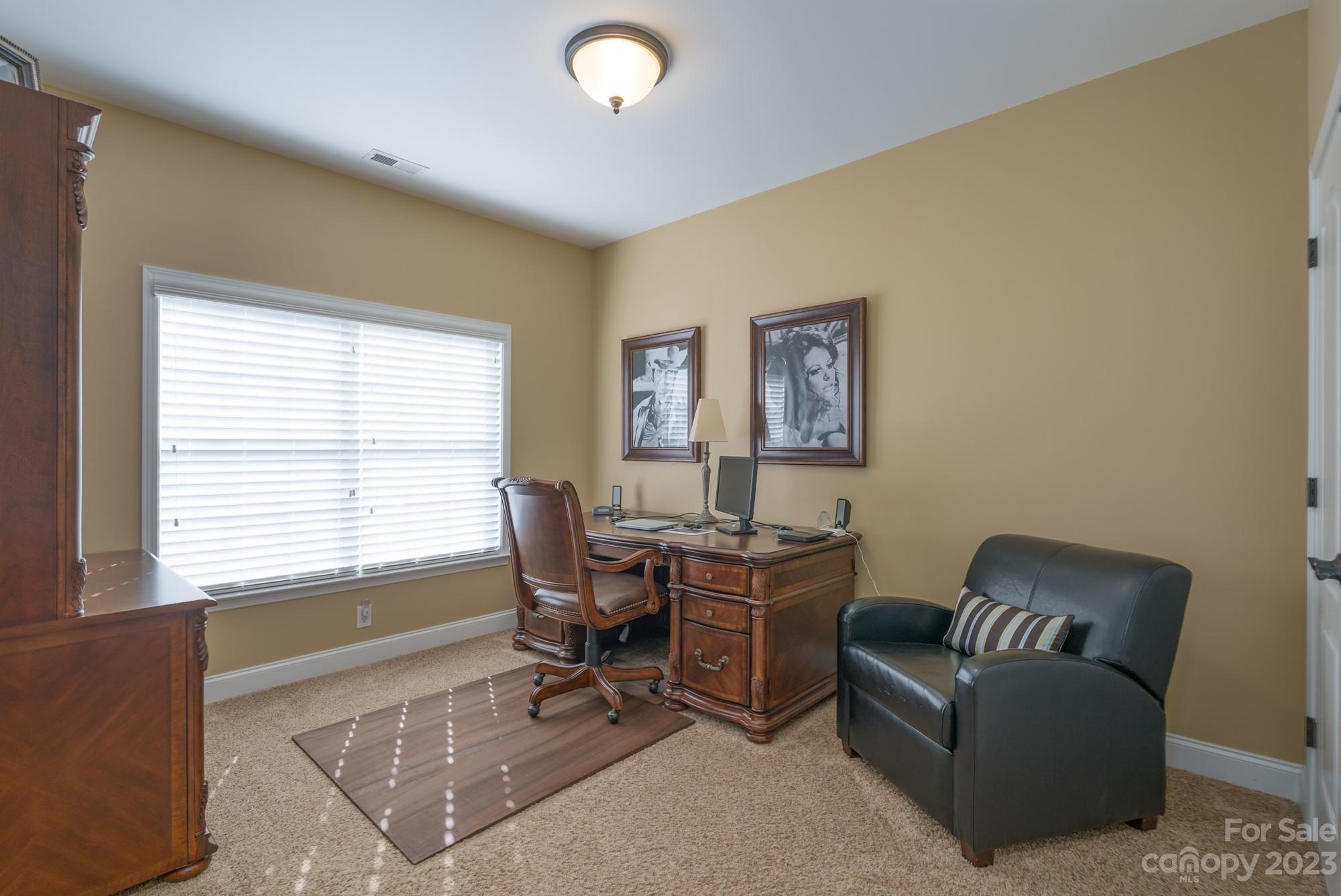657 Quicksilver Trail Fort Mill, SC 29708 - Photo 36 of 48 a work room with furniture wooden floor and a window