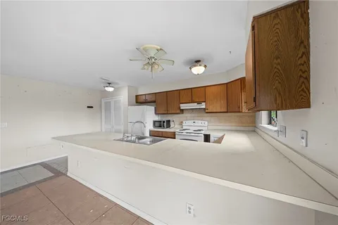 a kitchen with a sink counter top space and cabinets