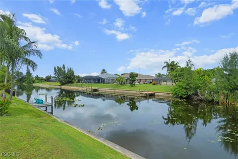 a view of lake with houses in the back