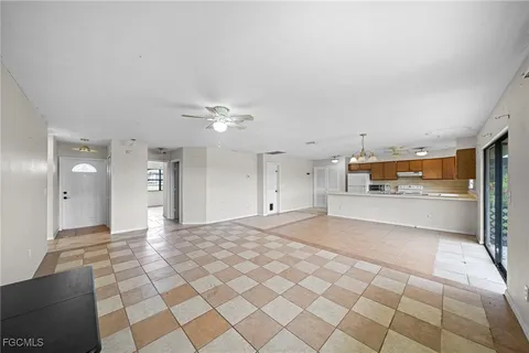 a view of a kitchen with a sink and cabinets