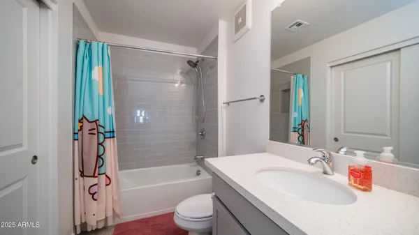 a bathroom with a shower and toilet