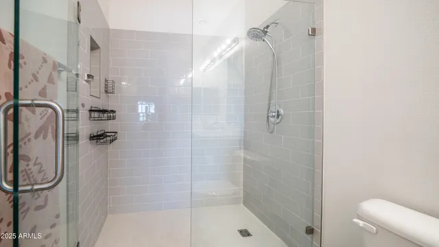 a bathroom with a sink mirror and toilet