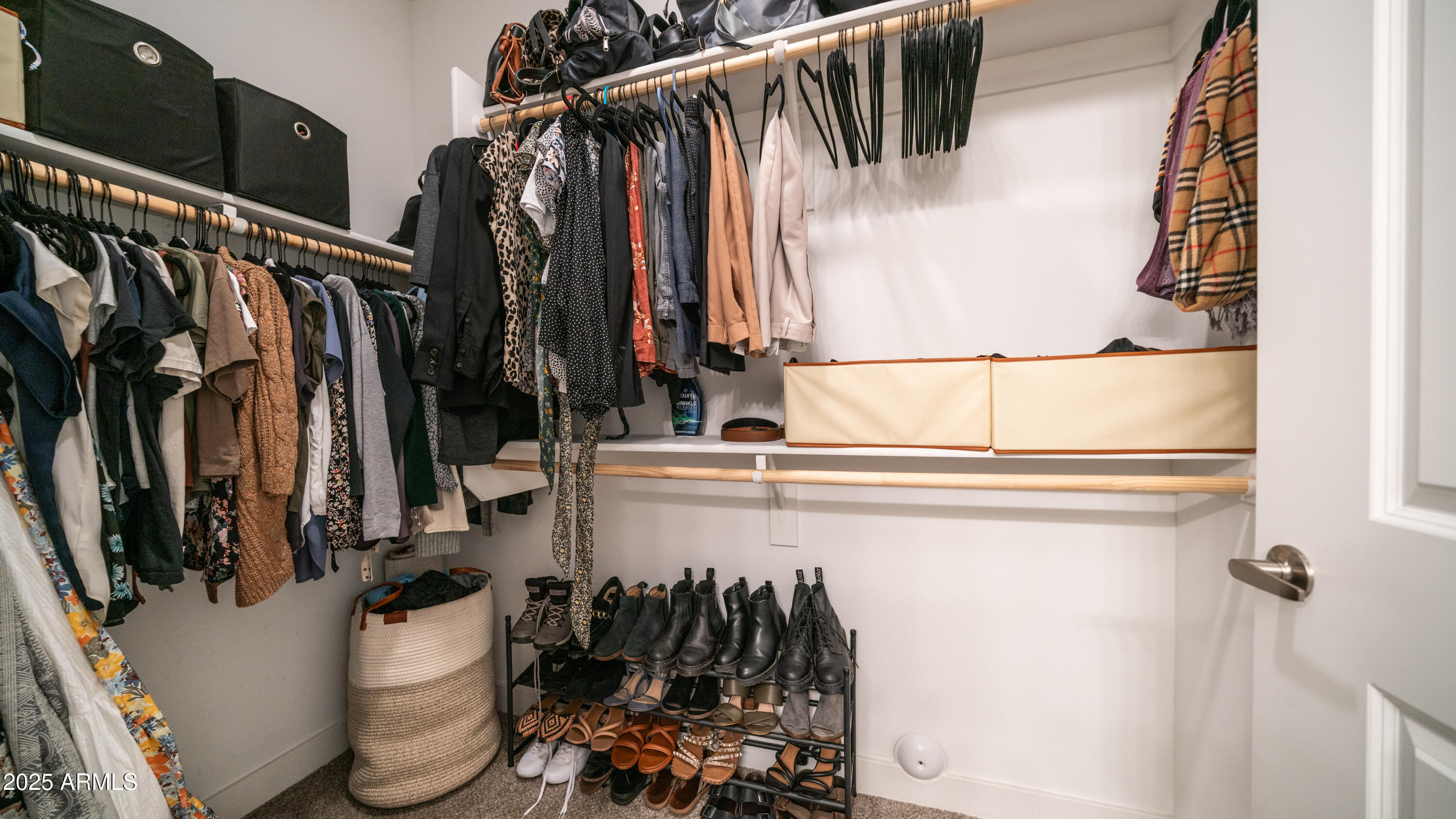 2511 West Queen Creek Road, Unit 479 Chandler, AZ 85248 - Photo 20 of 68 a view of walk in closet with clothes and shoes