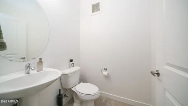 a view of a balcony with a chair and a floor to ceiling window