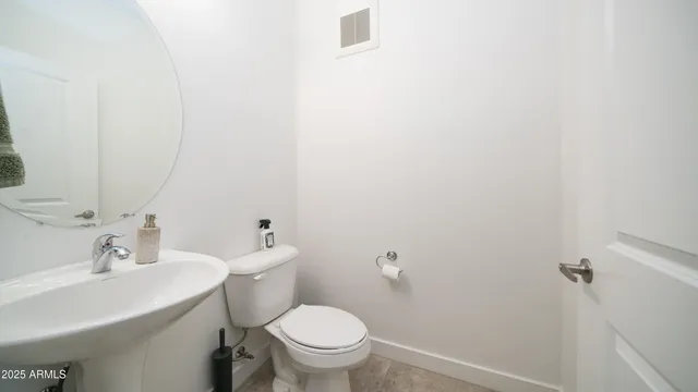 a view of a balcony with a chair and a floor to ceiling window