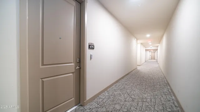 a view of a patio with a table and chairs and potted plants