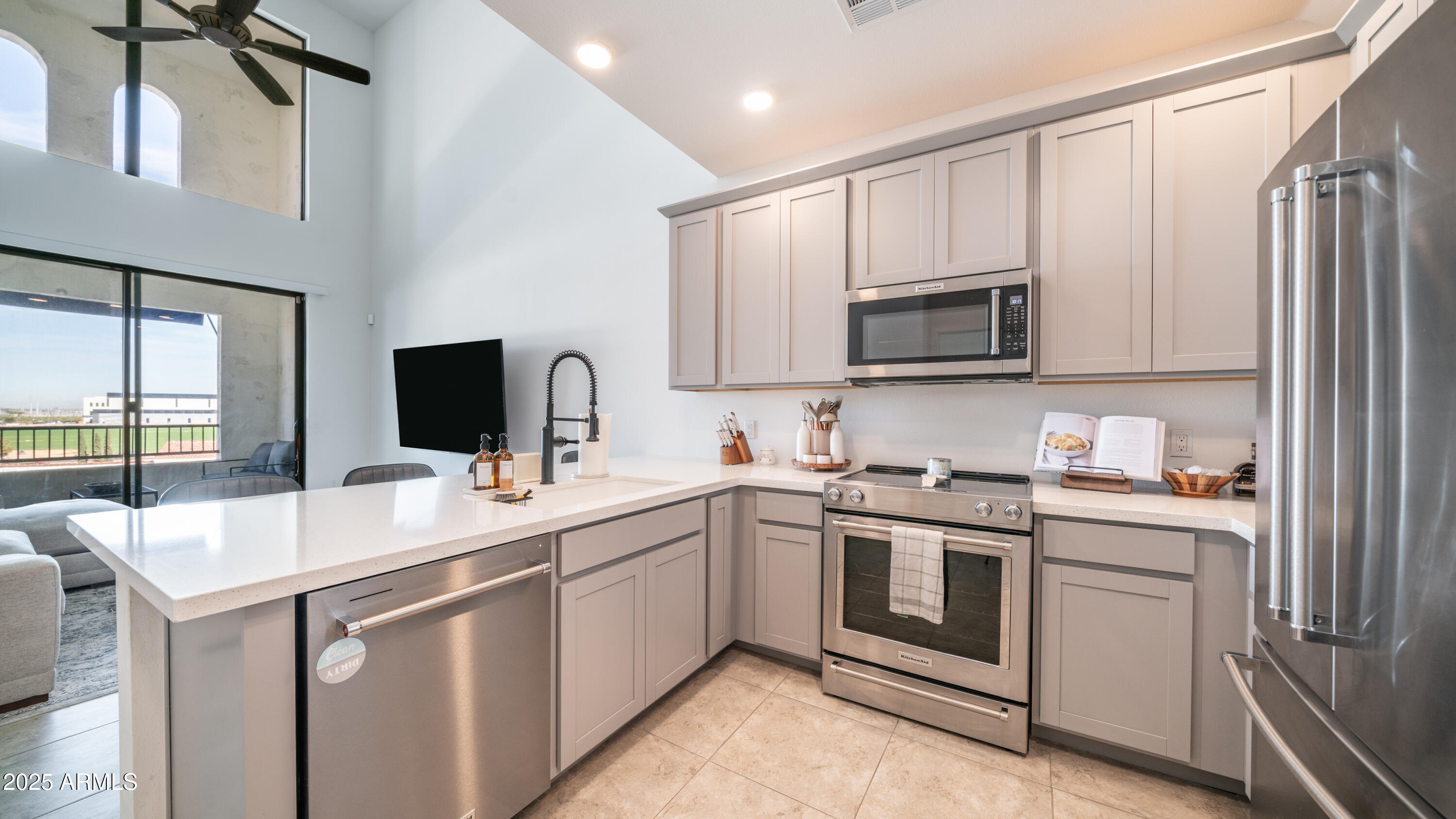 2511 West Queen Creek Road, Unit 479 Chandler, AZ 85248 - Photo 2 of 68 a kitchen with a sink stove and microwave