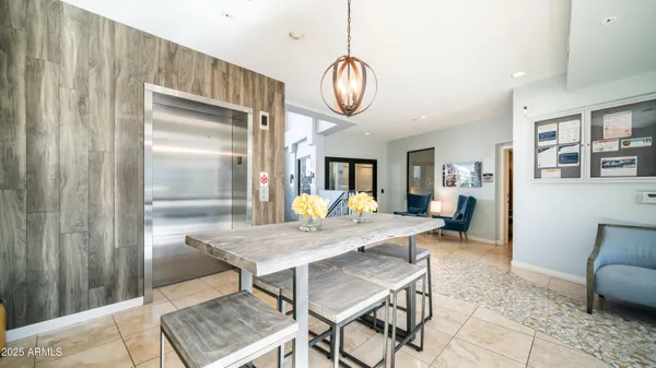a view of a livingroom with wooden floor and windows