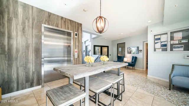 a view of a livingroom with wooden floor and windows