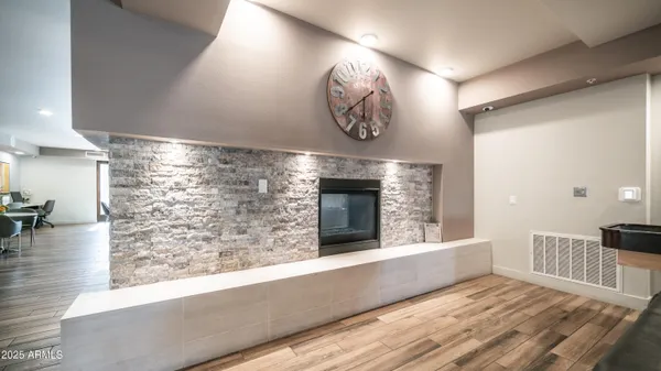 a view of a livingroom with furniture and hardwood floor