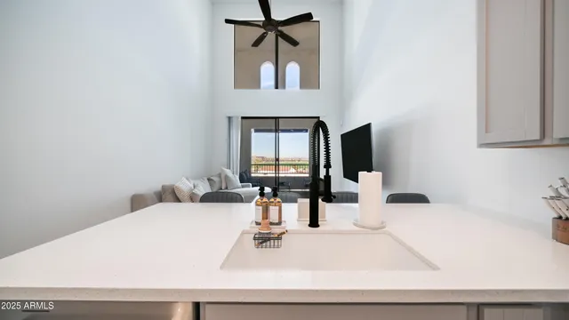 a kitchen with stainless steel appliances a sink and a refrigerator