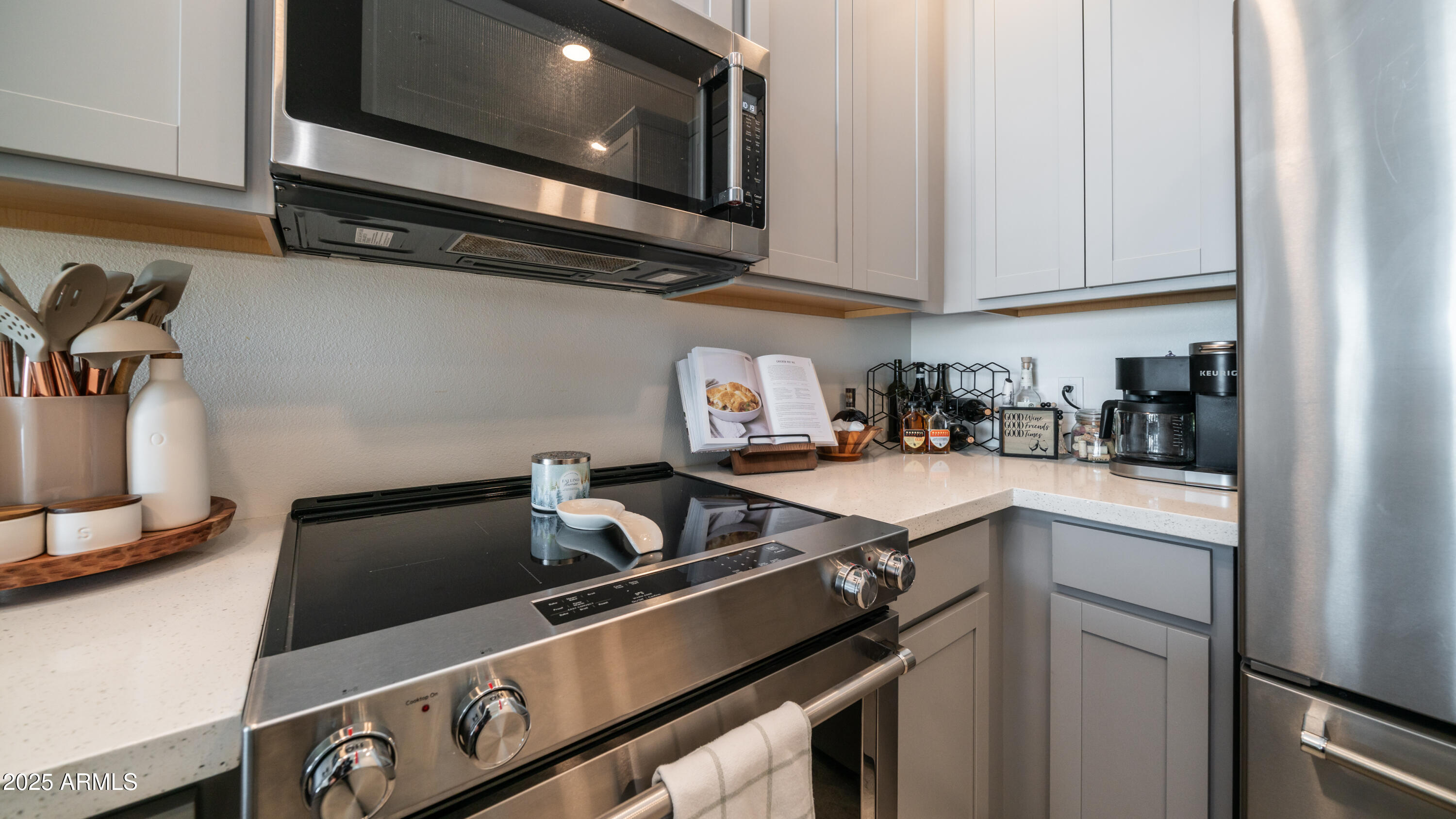 2511 West Queen Creek Road, Unit 479 Chandler, AZ 85248 - Photo 6 of 68 a kitchen with a stove and a microwave