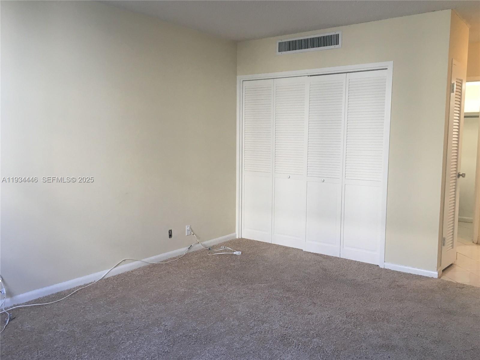 9225 Collins Avenue, Unit 305 Surfside, FL 33154 - Photo 6 of 10 a view of an empty room