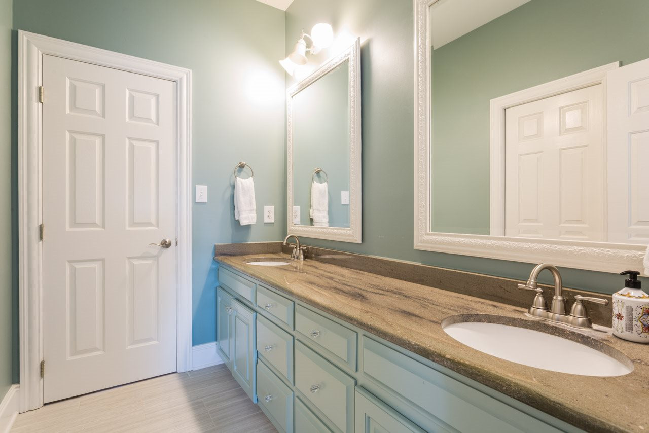 12528 Bayleaf Church Road Raleigh, NC 27614 - Photo 20 of 30 Shared by Bedroom #4 and #5. New Tile Surround! Granite Counter Top with Dual Sinks! Updated Tile Flooring! Jack and Jill-Style Bath
