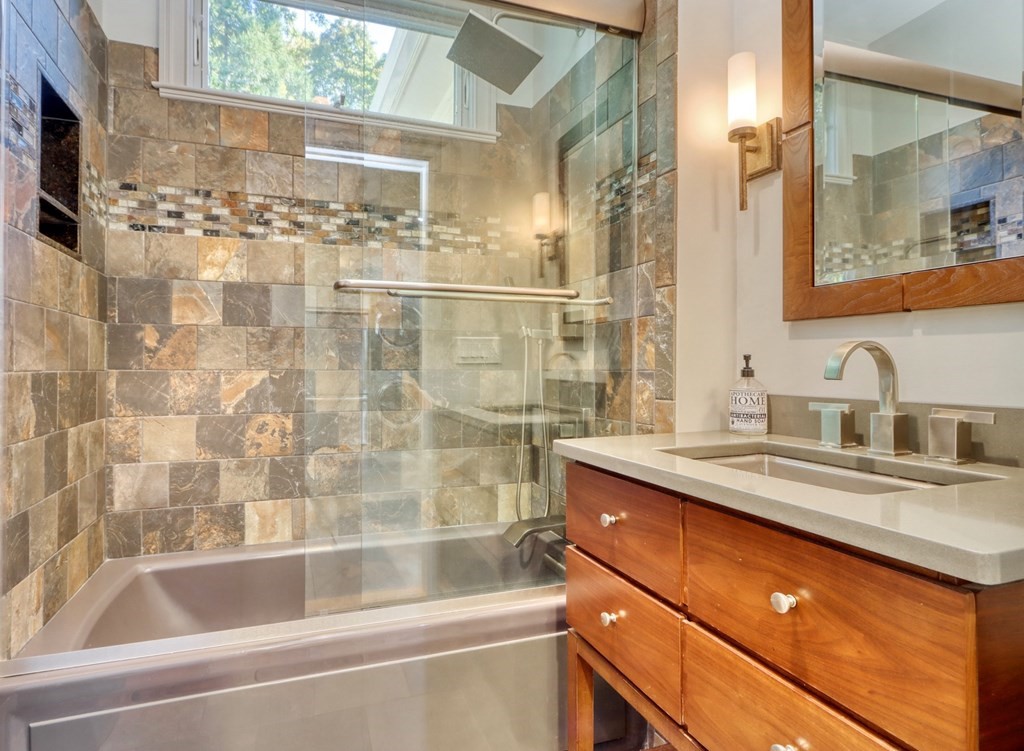 5 Chestnut Street Melrose, MA 02176 - Photo 18 of 42 a bathroom with a sink and a bathtub