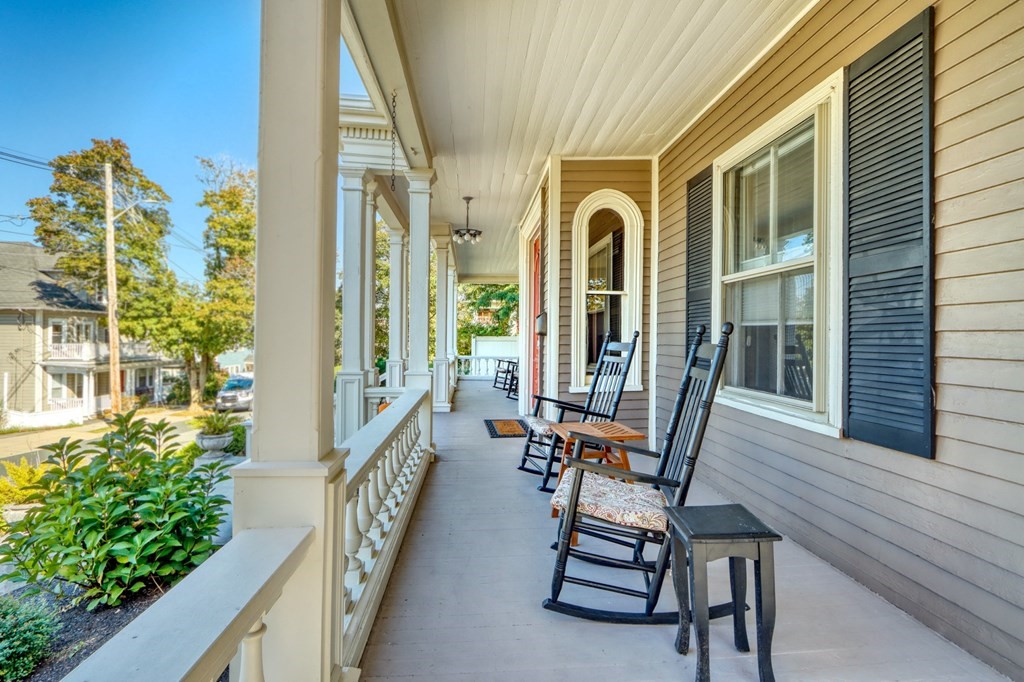 5 Chestnut Street Melrose, MA 02176 - Photo 2 of 42 a balcony with chairs and with potted plants