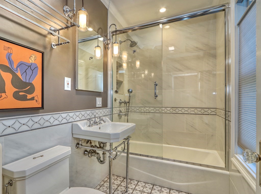 5 Chestnut Street Melrose, MA 02176 - Photo 22 of 42 a bathroom with a shower sink vanity and mirror