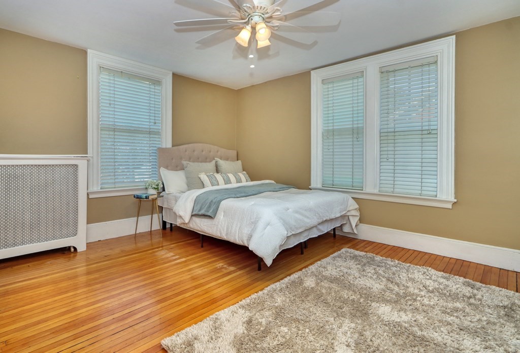 5 Chestnut Street Melrose, MA 02176 - Photo 24 of 42 a bedroom with a bed and window