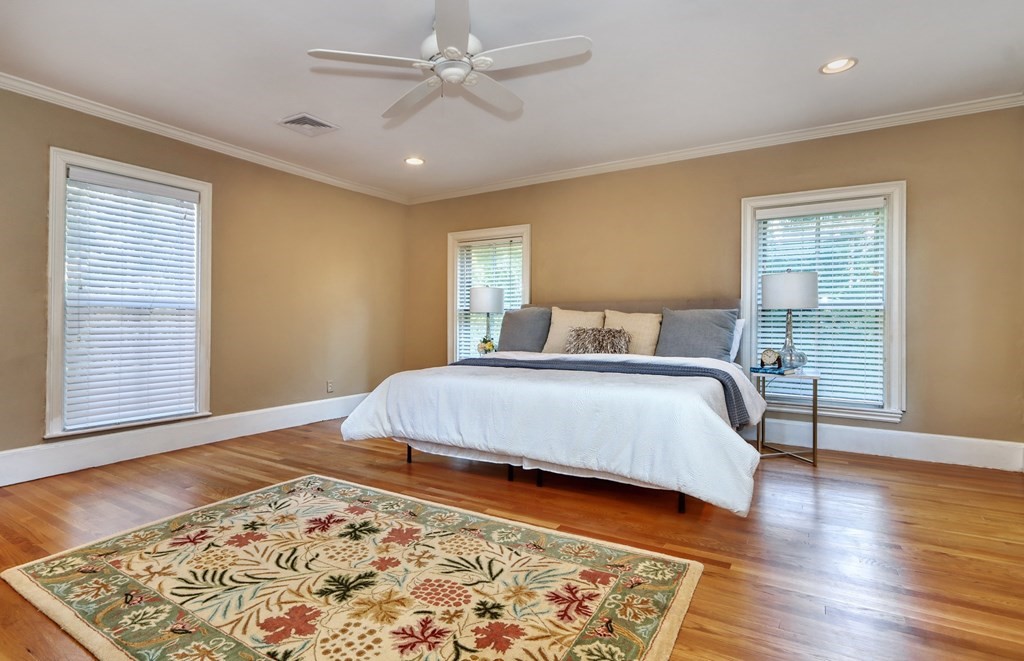 5 Chestnut Street Melrose, MA 02176 - Photo 27 of 42 a bedroom with a bed and wooden floor