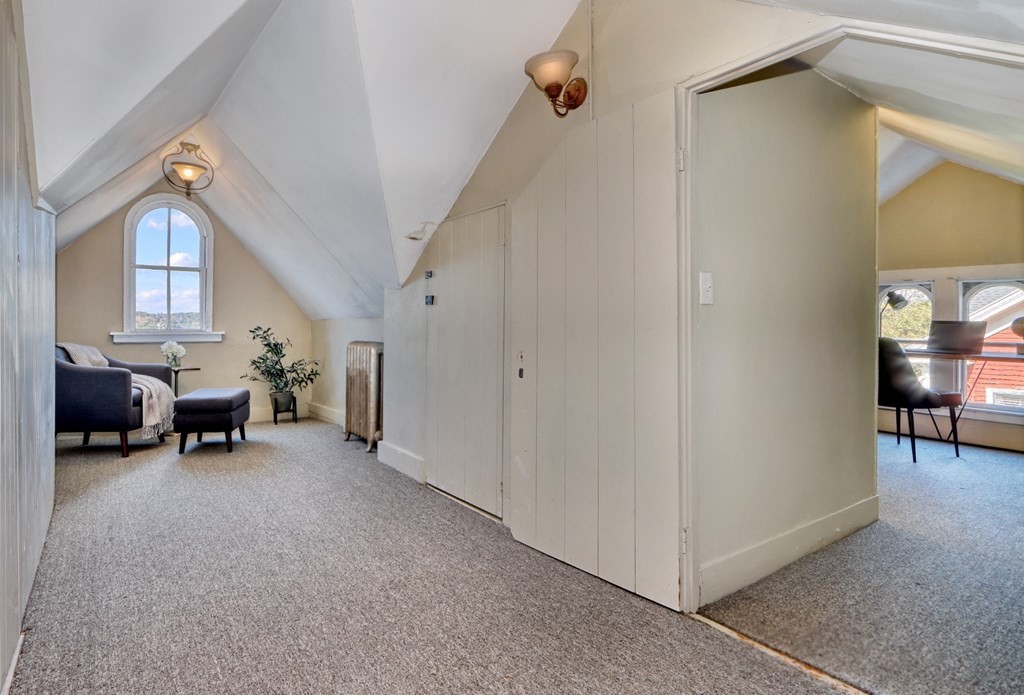5 Chestnut Street Melrose, MA 02176 - Photo 33 of 42 a view of a livingroom with furniture and a hallway