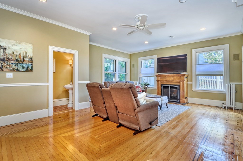 5 Chestnut Street Melrose, MA 02176 - Photo 7 of 42 a living room with furniture and a fireplace