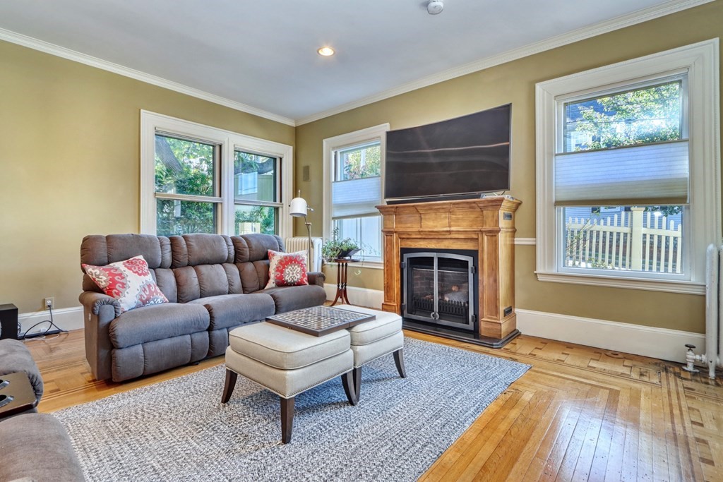 5 Chestnut Street Melrose, MA 02176 - Photo 8 of 42 a living room with furniture and a fireplace