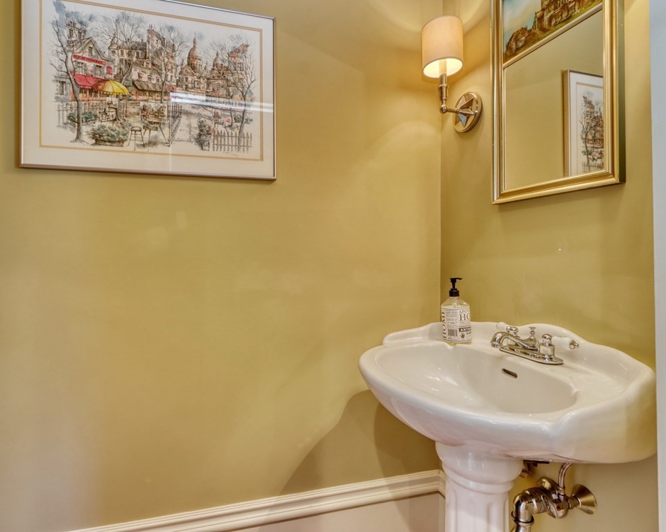 5 Chestnut Street Melrose, MA 02176 - Photo 9 of 42 a bathroom with a sink and a mirror