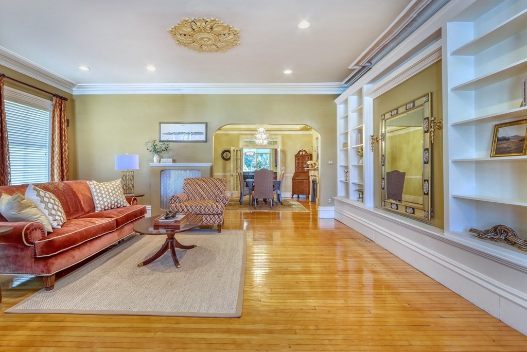 5 Chestnut Street Melrose, MA 02176 - Photo 10 of 42 a living room with furniture and a rug