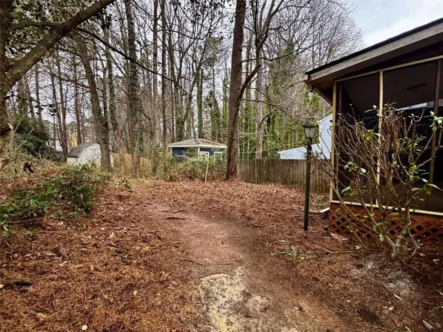 a backyard of a house with lots of green space