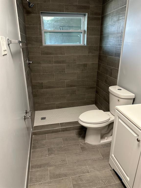 1250 East Sample Road, Unit 203 Pompano Beach, FL 33064 - Photo 3 of 5 a bathroom with a toilet and a shower