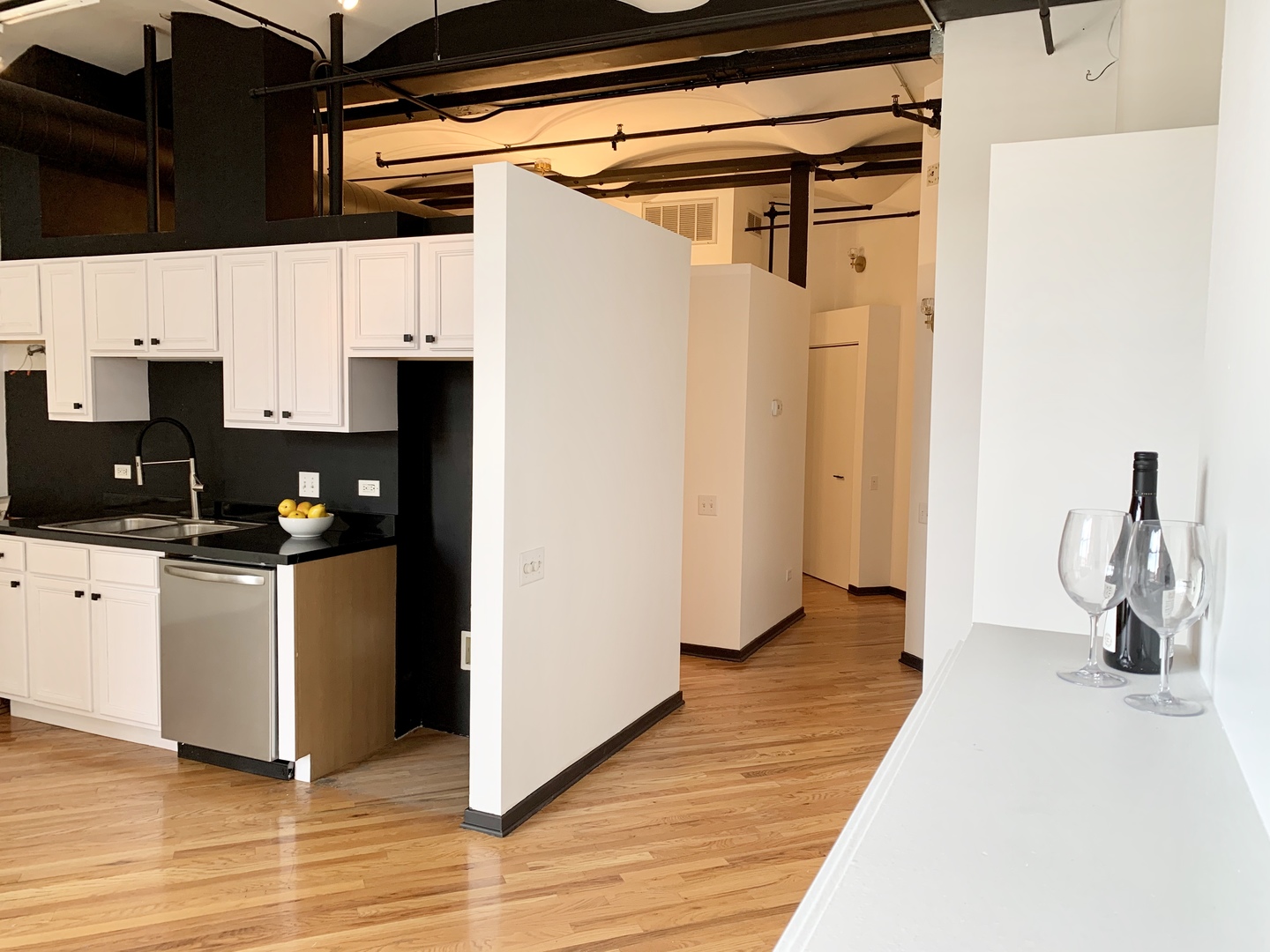 500 South Clinton Street, Unit 417 Chicago, IL 60607 - Photo 7 of 18 a kitchen with stainless steel appliances a refrigerator and a stove top oven
