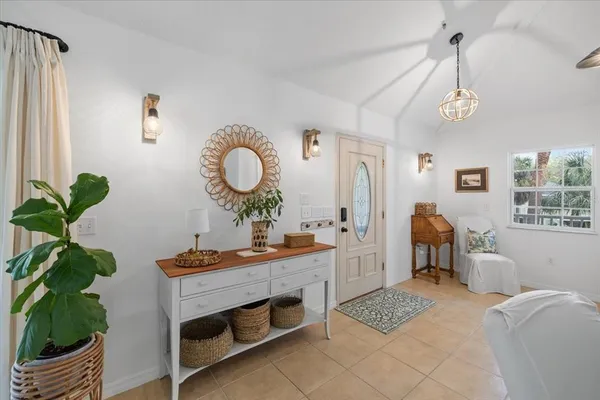 a bedroom with a bed couch and window