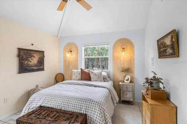 a swimming pool with outdoor seating yard and trees