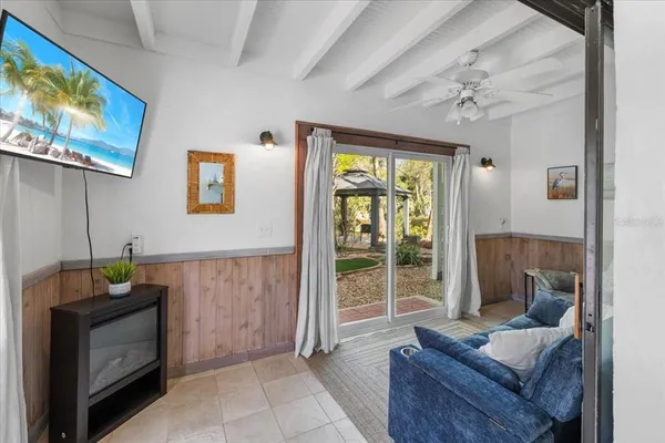 an aerial view of a house with a yard and lake view