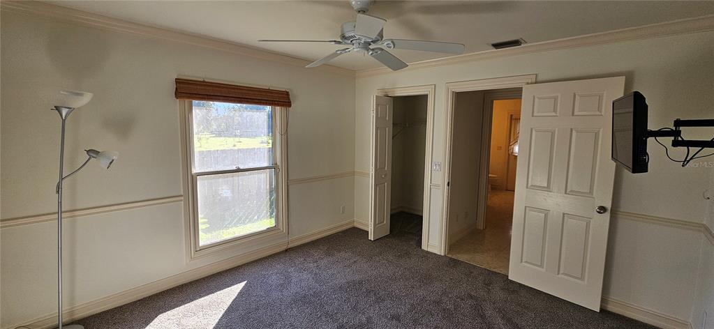 11729 Timberline Circle Fort Myers, FL 33966 - Photo 11 of 33 a view of empty room with windows and cabinet