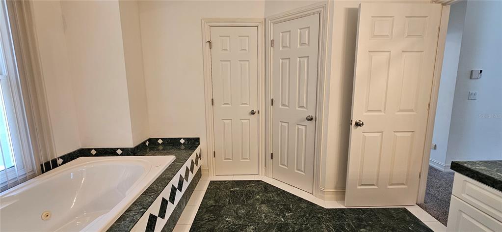 11729 Timberline Circle Fort Myers, FL 33966 - Photo 23 of 33 a bathroom with a tub and sink