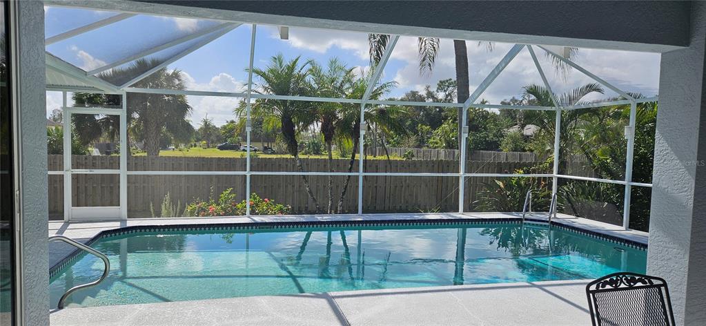 11729 Timberline Circle Fort Myers, FL 33966 - Photo 28 of 33 a view of a house with a swimming pool