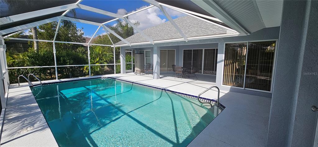 11729 Timberline Circle Fort Myers, FL 33966 - Photo 30 of 33 a view of a swimming pool with a lounge chair