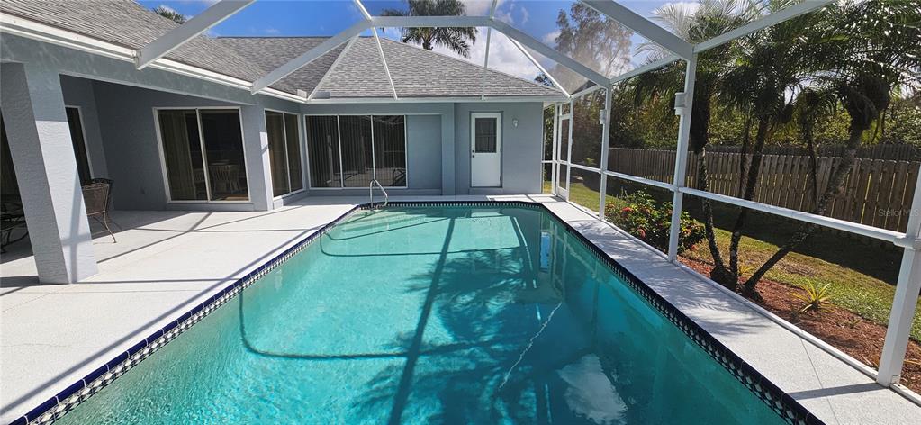 11729 Timberline Circle Fort Myers, FL 33966 - Photo 31 of 33 a view of swimming pool with a lounge chairs