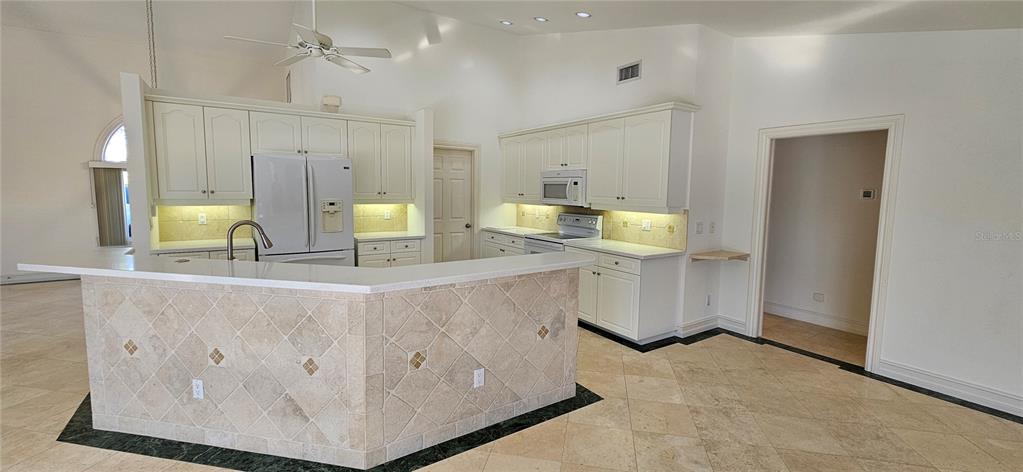 11729 Timberline Circle Fort Myers, FL 33966 - Photo 7 of 33 a view of a kitchen with appliances and cabinets