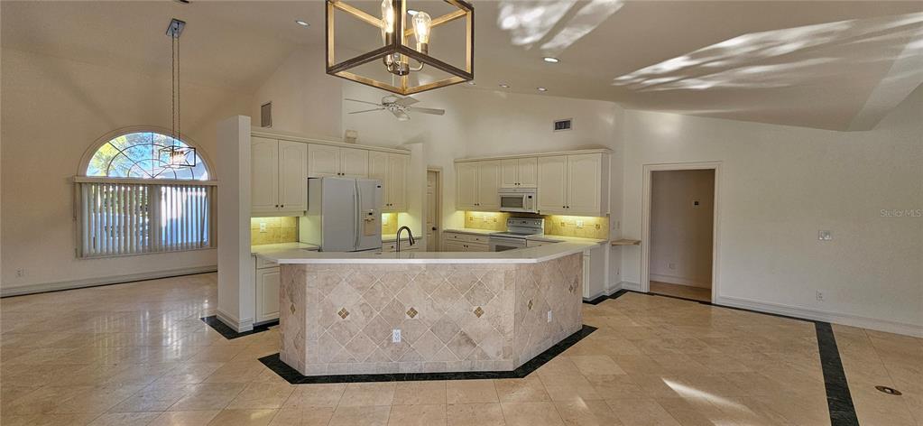 11729 Timberline Circle Fort Myers, FL 33966 - Photo 8 of 33 a view of living room and kitchen