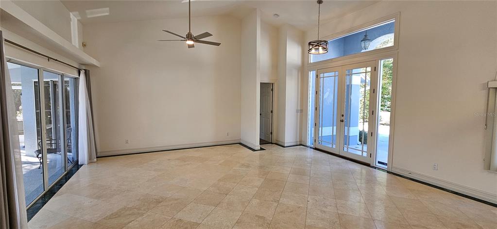 11729 Timberline Circle Fort Myers, FL 33966 - Photo 9 of 33 a view of an empty room with a glass door